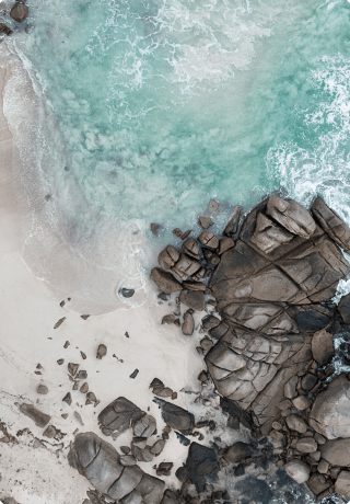 Picturesque bays and sandy beaches surrounded by tropical greenery